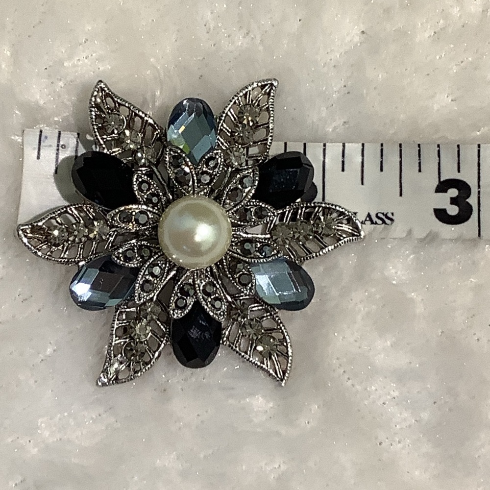 Elegant Silver and Black Floral Brooch